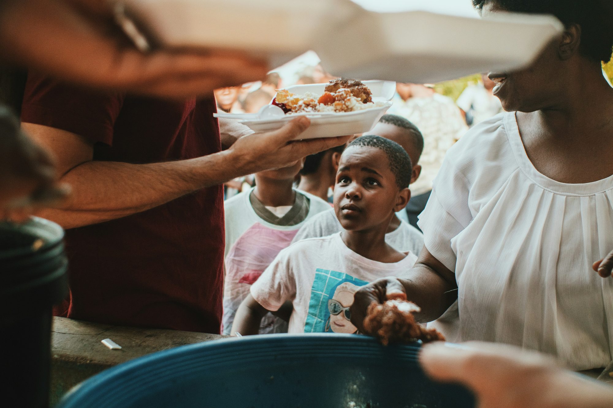A child receiving a warm meal at one of our community food events